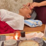 facial and body massage done on client by staff