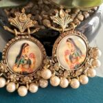 an earring with is so beautiful and have some traditional lady print on it...