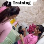 a women teacher training her students for beauty services course