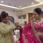 a women supporting another women by wearing her jewellery