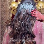 a women showing her hairstyle with accessory on hairs